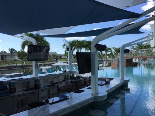 The "Lazy River" pool with swim up bar at the Hilton Resorts World Bimini